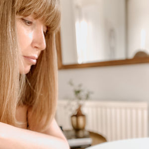 Portrait of woman sitting at home