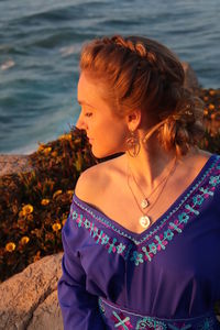 Woman looking at sea shore