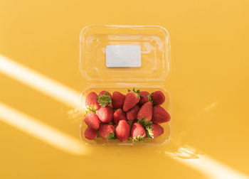 High angle view of fruits in container on table