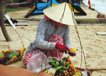 Low section of person holding fruits