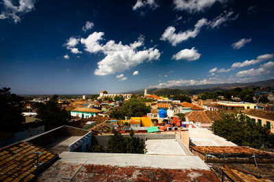 High angle view of buildings in city against sky