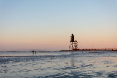 Scenic view of sea against clear sky during sunset