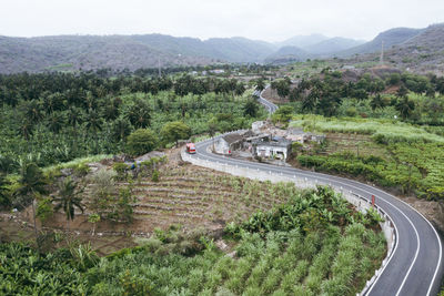 High angle view of road amidst mountains against sky