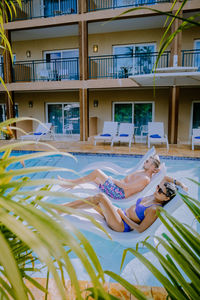 Woman relaxing on swimming pool