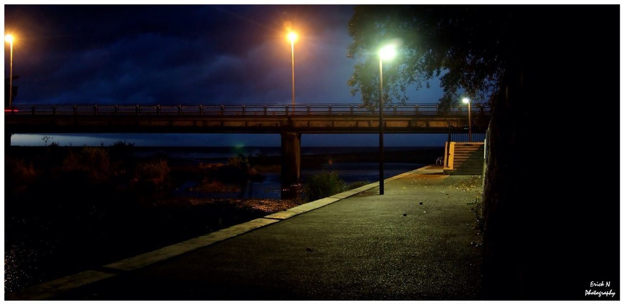 VIEW OF ILLUMINATED STREET LIGHT AGAINST SKY