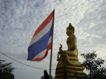 Low angle view of statue against sky