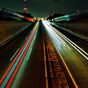 High angle view of light trails on railroad tracks at night