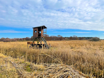 Built structure on field against sky