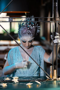 Portrait of woman holding water