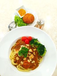 High angle view of japanese curry pasta served on table