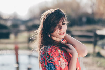 Portrait of woman standing outdoors