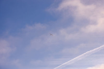 Low angle view of airplane against sky