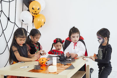 Group of people sitting on table