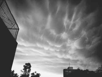 Low angle view of building against cloudy sky