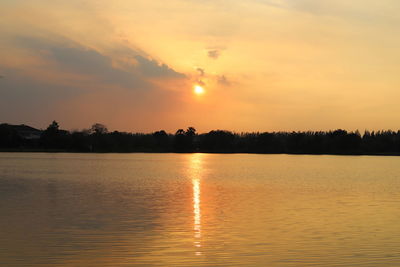 Scenic view of lake against sky during sunset