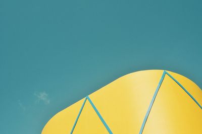 Low angle view of tent on beach against clear sky