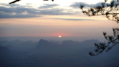 Scenic view of silhouette mountains against sky during sunset