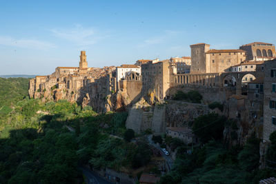 Pitigliano cityscape with buildings in early morning light in tuscany 