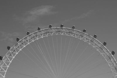 Low angle view of ferris wheel against sky