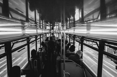 People sitting in illuminated city