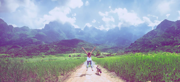 Rear view of man walking on mountain