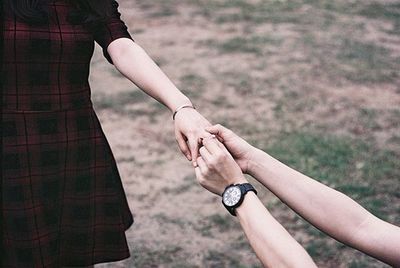 Cropped image of woman holding hands