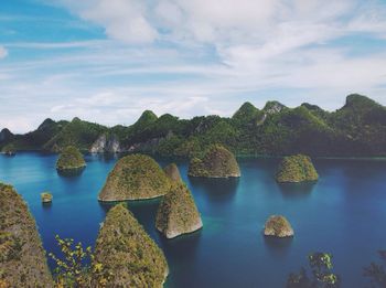 Scenic view of lake against cloudy sky