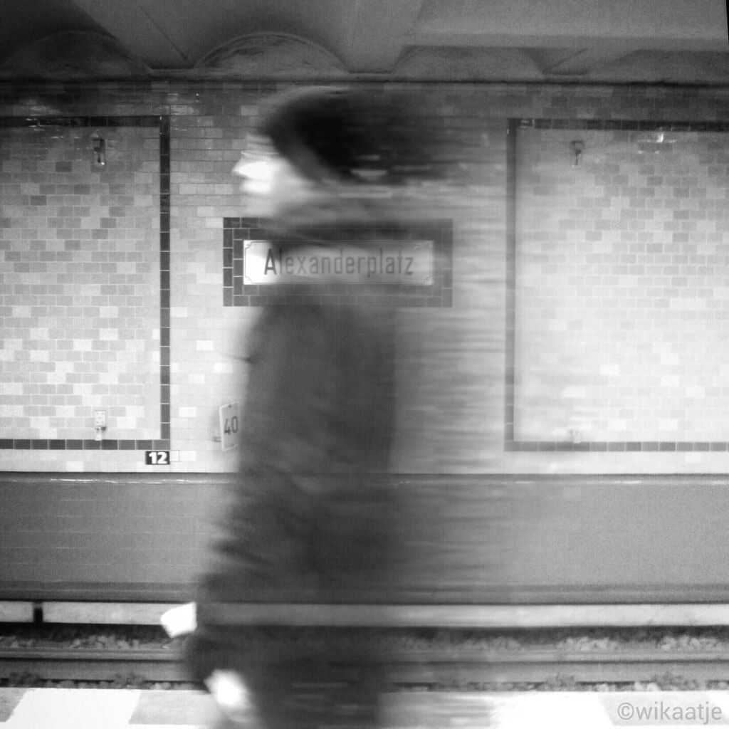 WOMAN WALKING IN SUBWAY