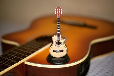 Close-up of guitar on table