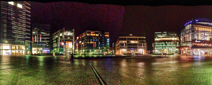 Buildings in city at night