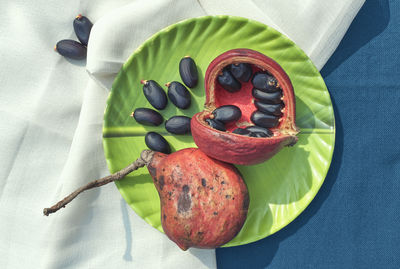 High angle view of fruits in plate on table