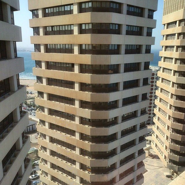 building exterior, architecture, built structure, city, building, window, residential building, residential structure, apartment, in a row, repetition, modern, balcony, office building, city life, outdoors, day, skyscraper, no people, residential district