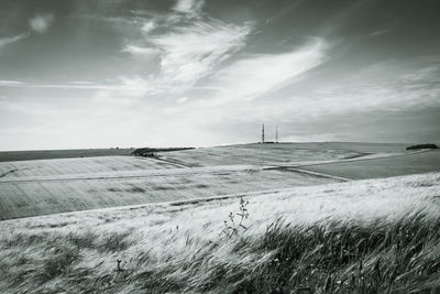 Scenic view of snowy field against sky