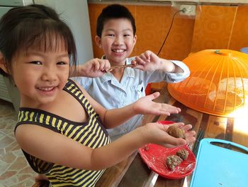 Portrait of smiling boy and woman