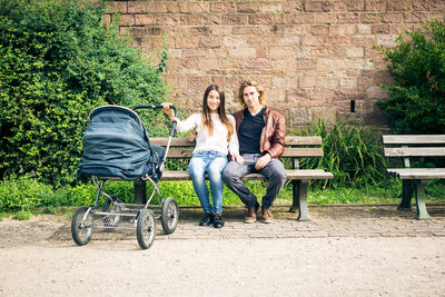 Women sitting on bench in park