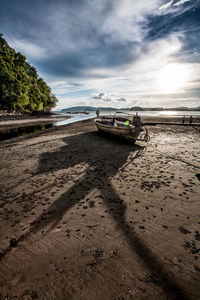 Abandoned boat on shore