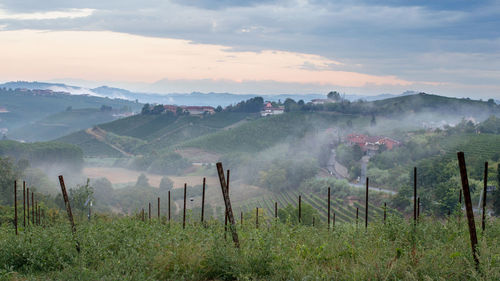 Scenic view of mountains against cloudy sky