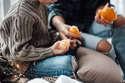 Midsection of woman holding ice cream