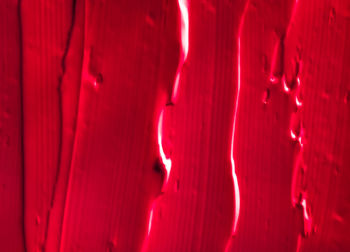 Full frame shot of illuminated red light