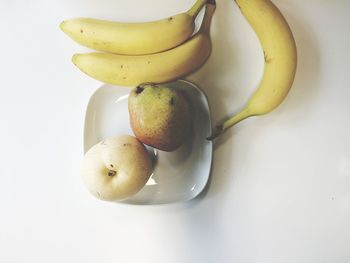 Close-up of fruit over white background