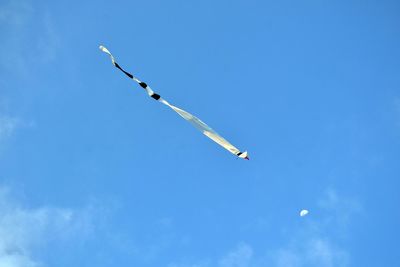 Low angle view of airplane flying in sky