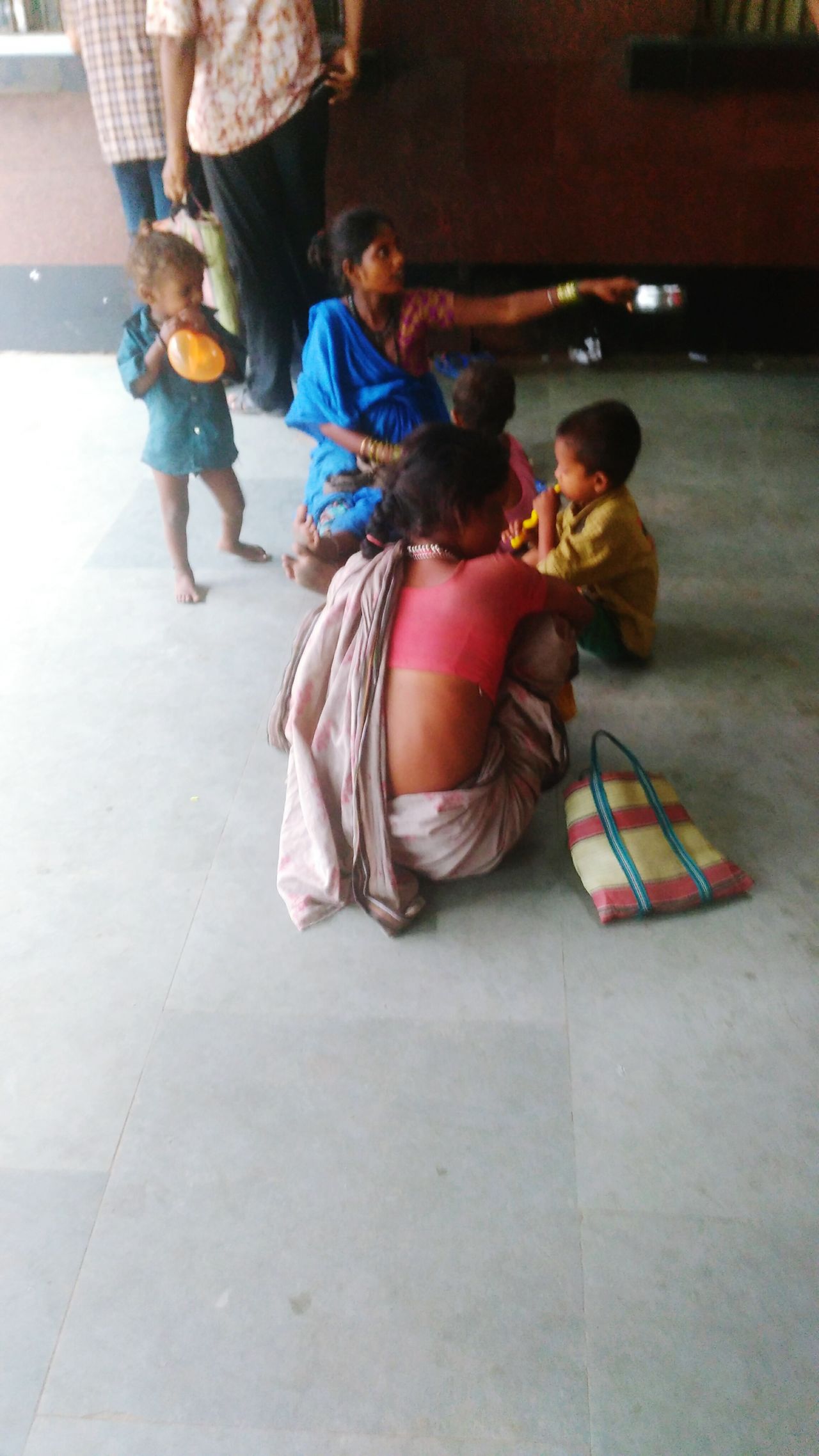 Mother begging ,Son playing