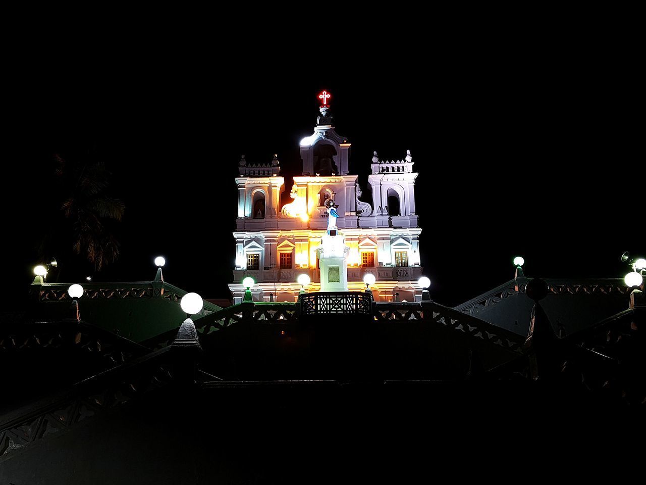 ILLUMINATED MOSQUE AGAINST CLEAR SKY AT NIGHT