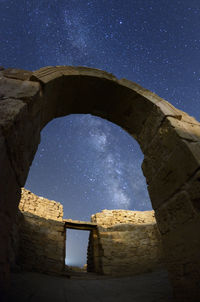 Low angle view of old ruins against blue sky