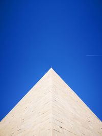 Low angle view of building against blue sky