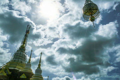 Low angle view of statue against cloudy sky