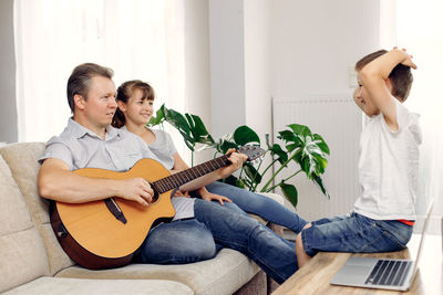 Young man using laptop at home