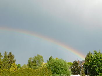 Low angle view of rainbow against sky