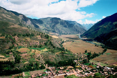 Scenic view of agricultural landscape against sky
