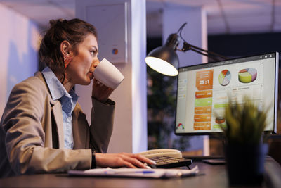 Portrait of young businesswoman working at office